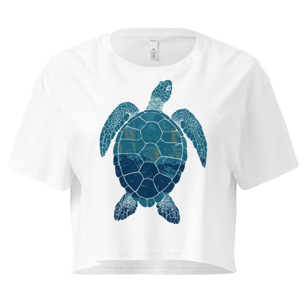 Front view of white Sea Turtle crop top with blue and green sea turtle graphic, Left Wing Designs